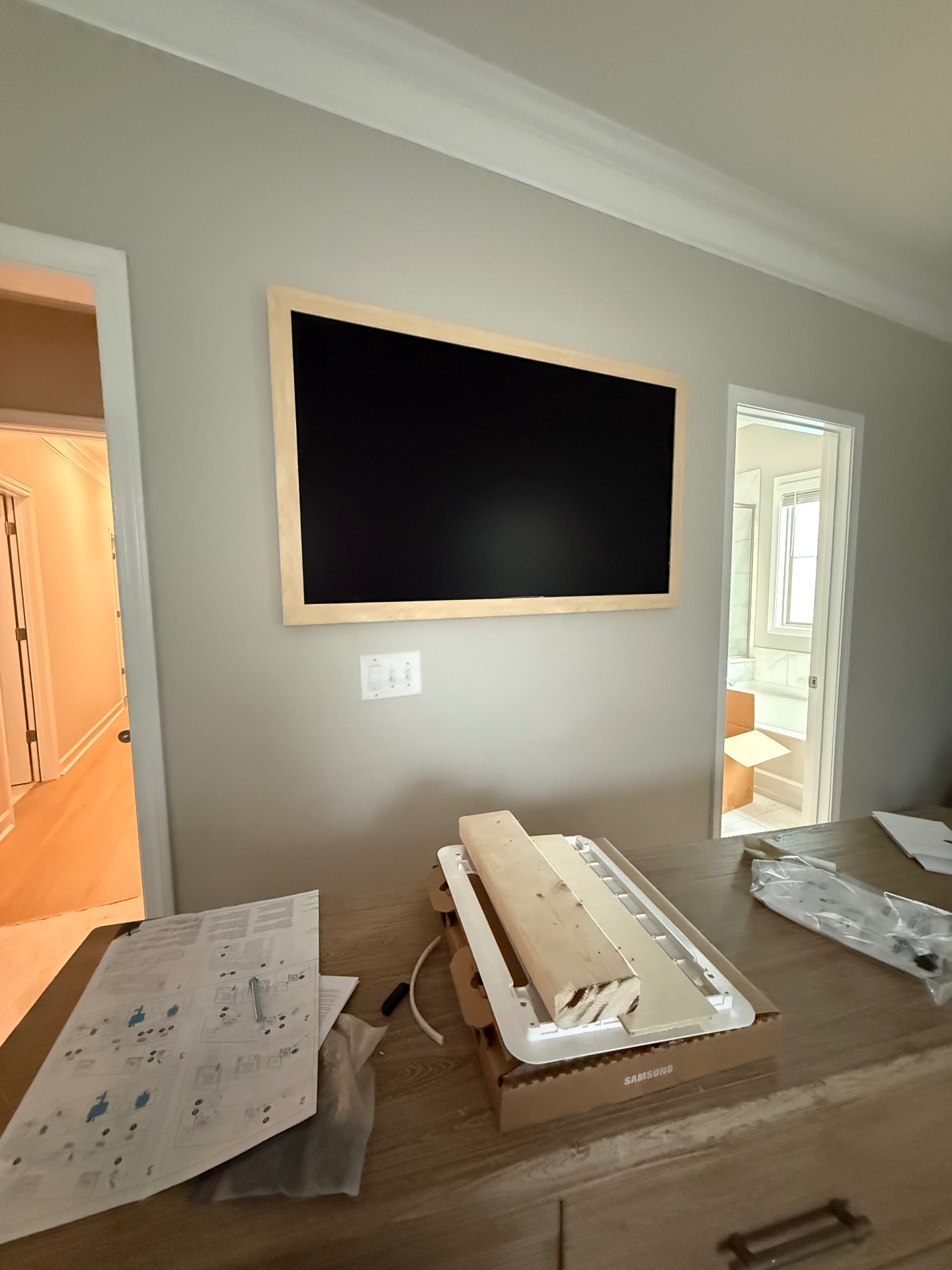 55-inch Samsung Frame TV mounted on drywall in Atlanta, GA bedroom with in-wall concealment box installed behind the TV