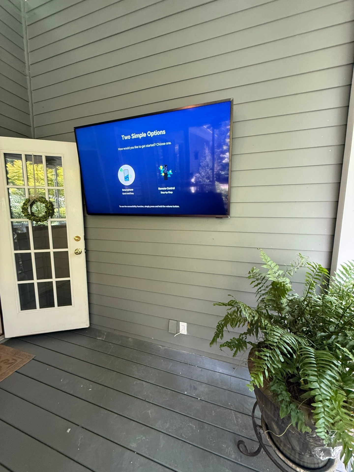 TV mounted on covered porch with tilt bracket in Hiram, GA