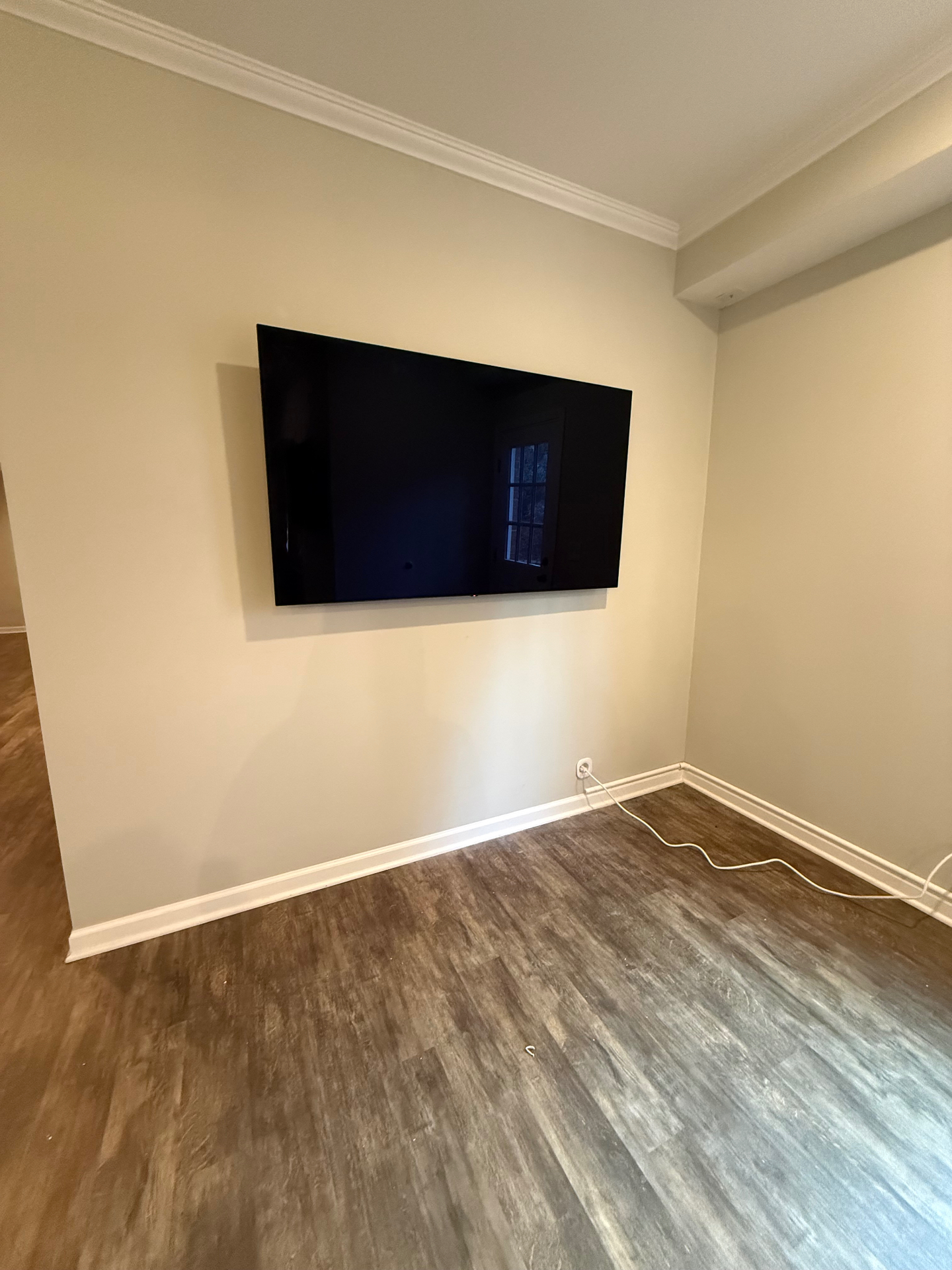 65-inch TV mounted on drywall in Ball Ground, GA