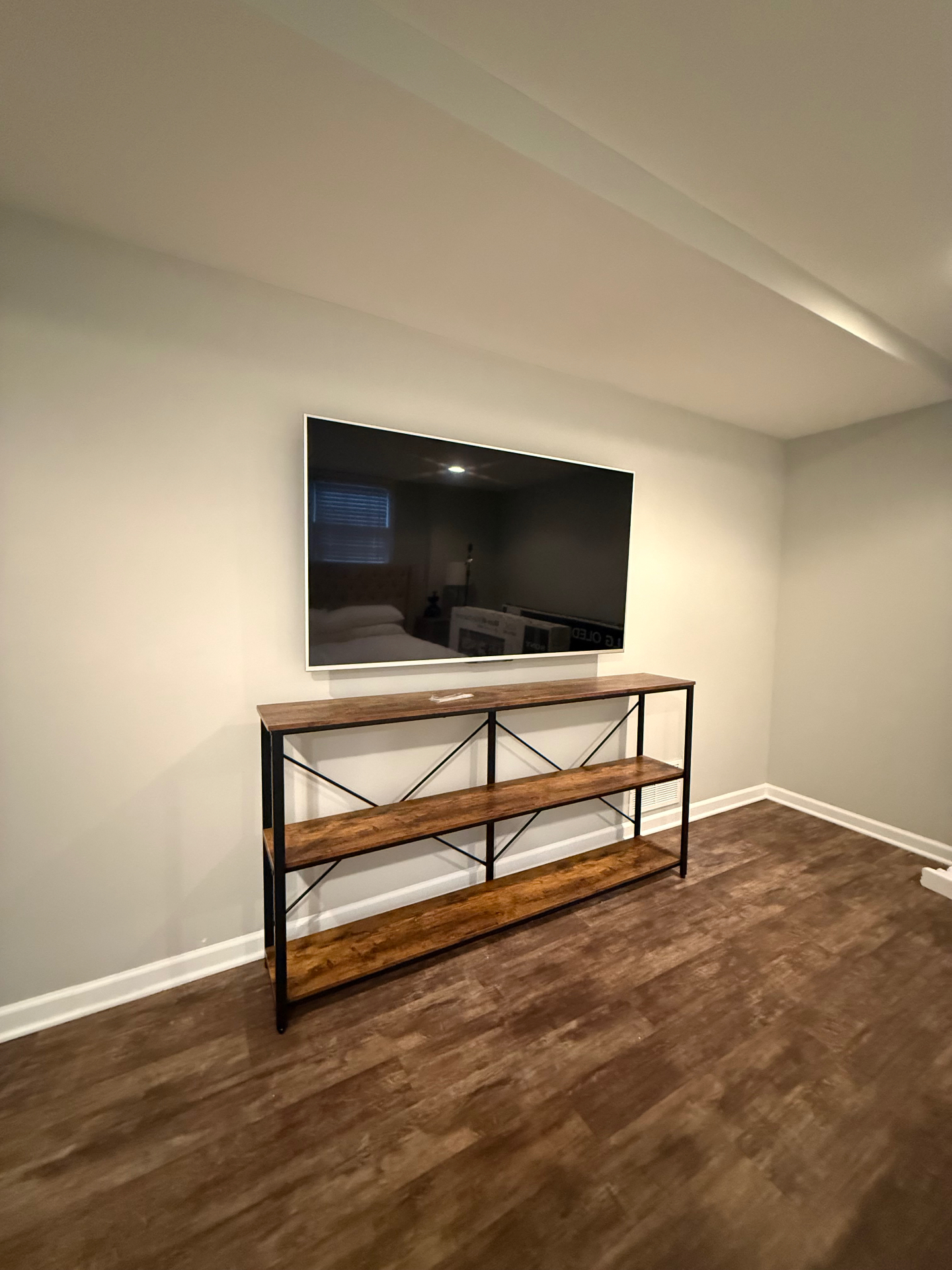 65-inch TV mounted on drywall in Sandy Springs, GA