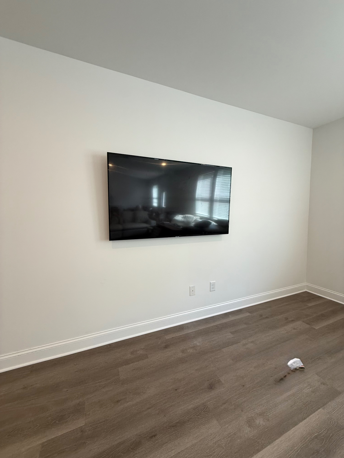 65-inch TV mounted on drywall in Buford, GA