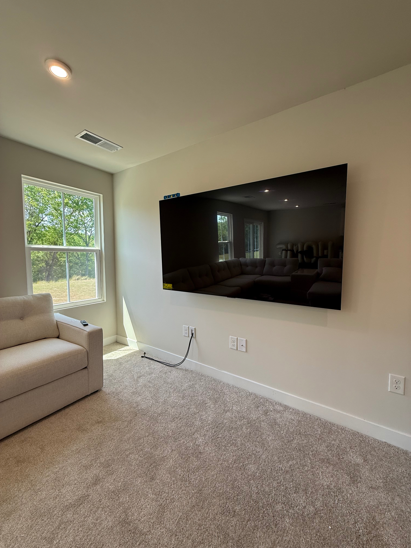 75-inch TV mounted on drywall in Calhoun, GA