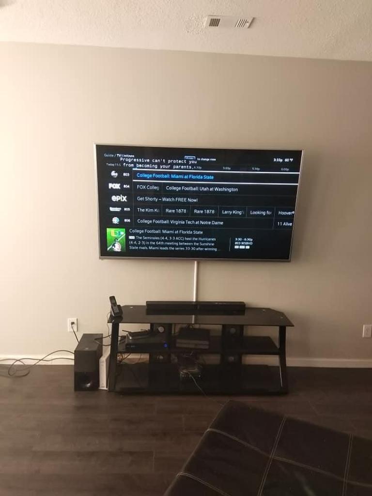 Can one person hang a TV on the wall?