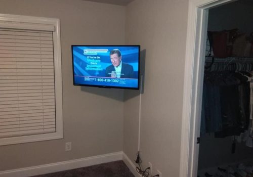 Can one person hang a TV on the wall?