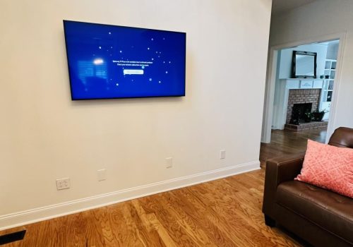 Can one person hang a TV on the wall?